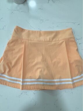 TRUE LIGHT Peach Pleated Tennis Skirt with White Stripes